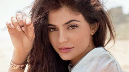 Close-up of a brunette celebrity model's face with subtle makeup and tousled hair — 4K Ultra HD desktop wallpaper.