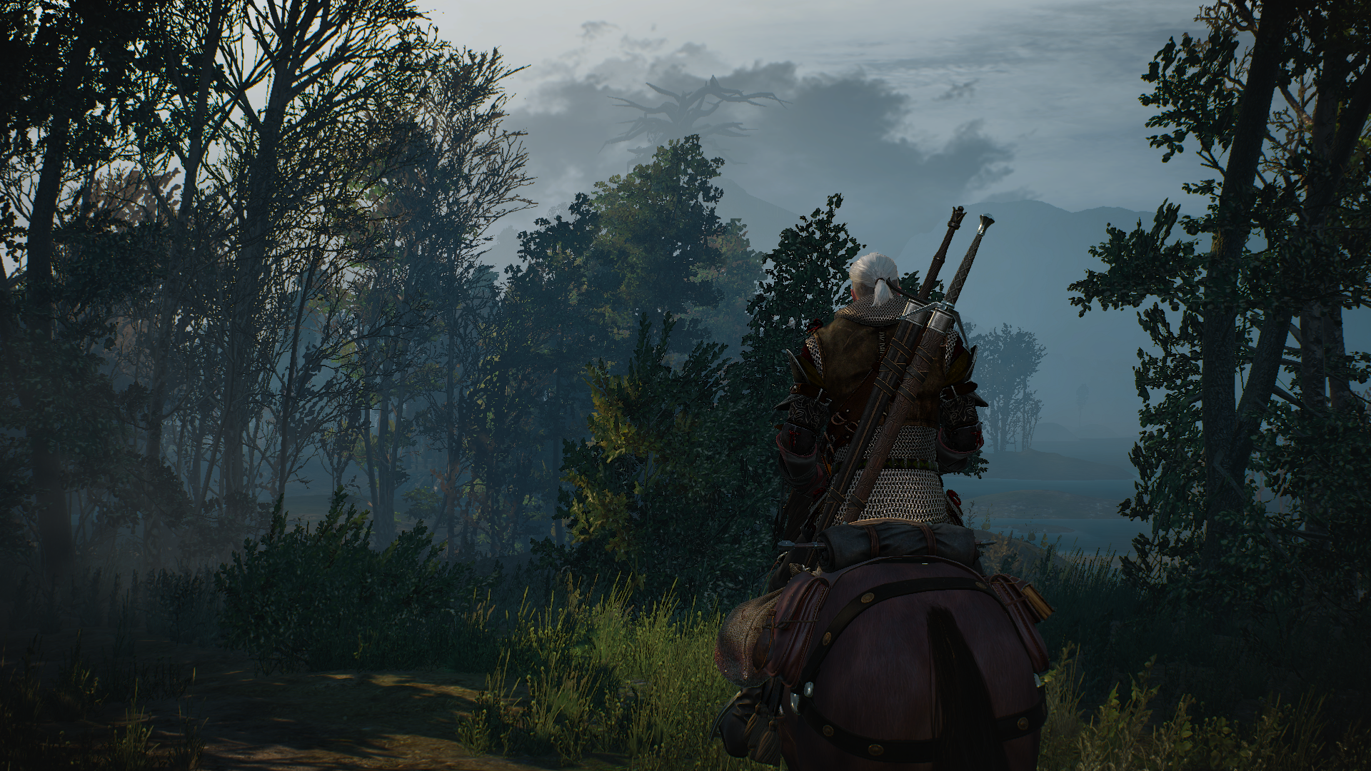Geralt of Rivia rides his horse through a misty forest in this HD desktop wallpaper from the video game The Witcher 3: Wild Hunt.