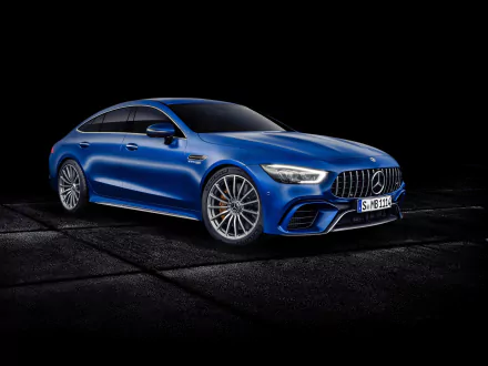 Sleek blue Mercedes-AMG GT63 S grand tourer supercar showcased as a 4K Ultra HD desktop wallpaper, highlighting the powerful design of this Mercedes-Benz vehicle.