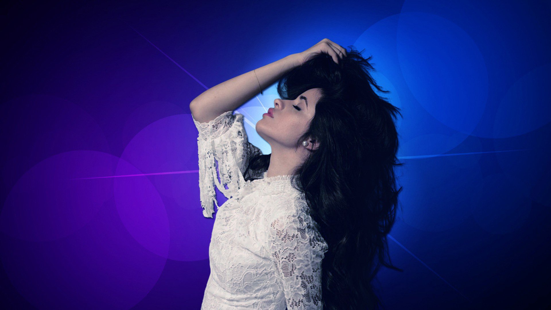 HD desktop wallpaper of a female singer with long black hair in a white lace dress, striking a dramatic pose against a blue-purple bokeh background.
