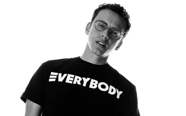 HD desktop wallpaper featuring a monochrome portrait of a man in glasses wearing a T-shirt with 'EVERYBODY' text, tagged with Logic.