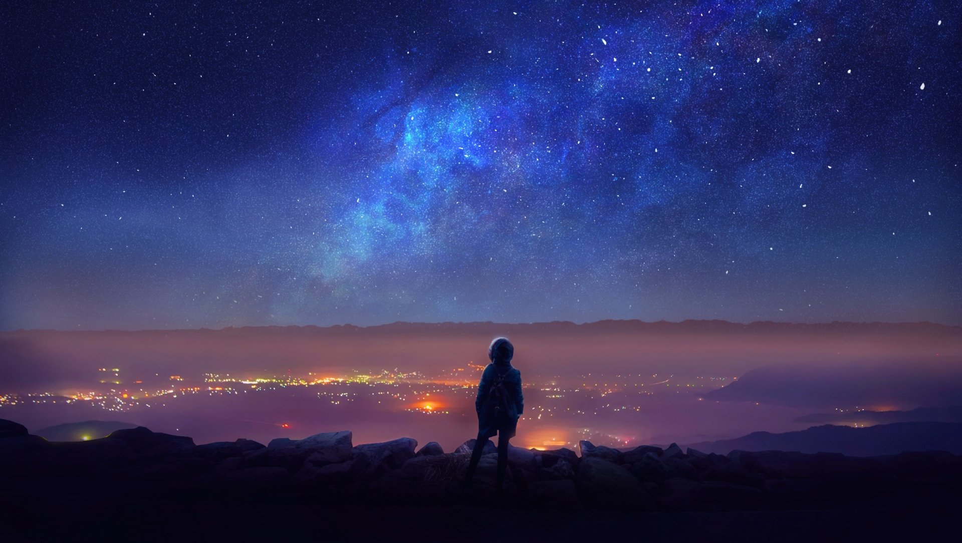 HD desktop wallpaper of a fantasy landscape at night, featuring a child gazing at a starry sky full of stars and vibrant colors. The luminous cityscape below complements the enchanting view above.
