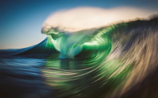 HD PC desktop wallpaper showcasing a powerful ocean wave in nature, captured with dynamic motion and vibrant colors.