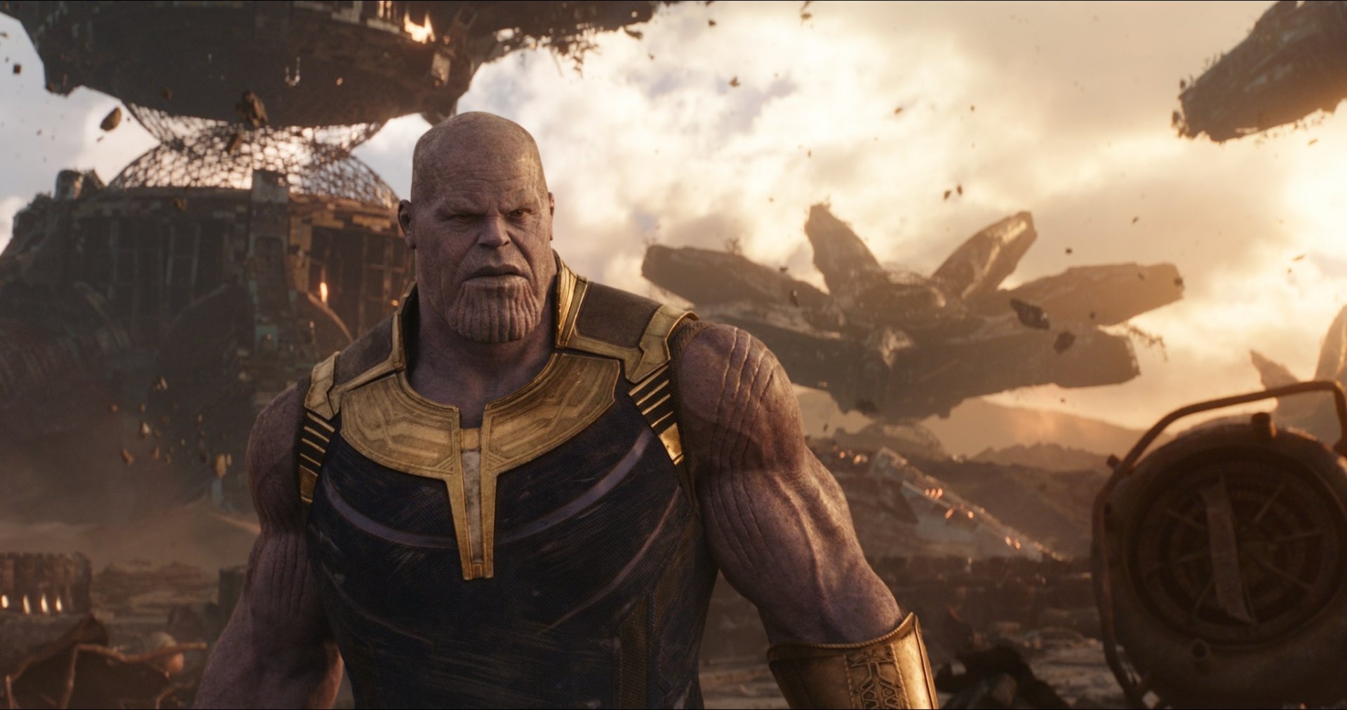 HD desktop wallpaper featuring Josh Brolin as Thanos in the movie Avengers: Infinity War, showcasing the character in a devastated landscape background.