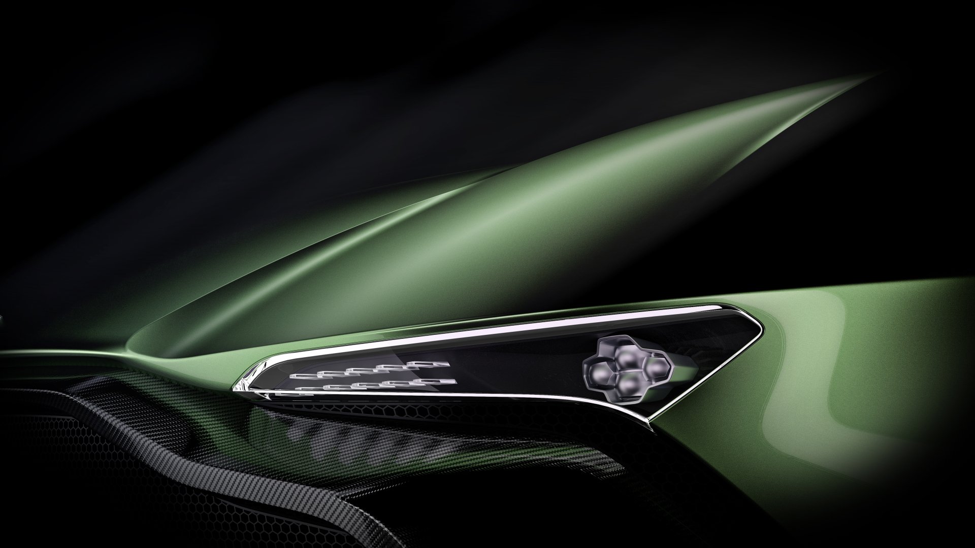 Close-up of the sleek side mirror of a green Aston Martin Vulcan hypercar, showcased as a 4K Ultra HD race car wallpaper and background.