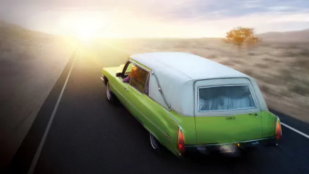 HD PC desktop wallpaper/background of a green vintage hearse driving toward a sunlit horizon on an empty highway — TV show Six Feet Under.
