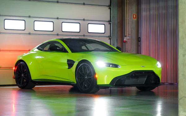 Green Aston Martin Vantage supercar parked in a garage, rendered in 4K Ultra HD PC desktop wallpaper background.