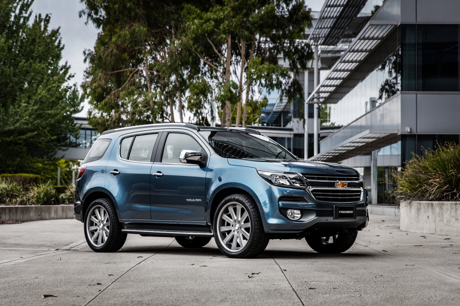 A sleek Chevrolet TrailBlazer SUV parked outdoors near modern architecture, captured in sharp 4K Ultra HD quality.