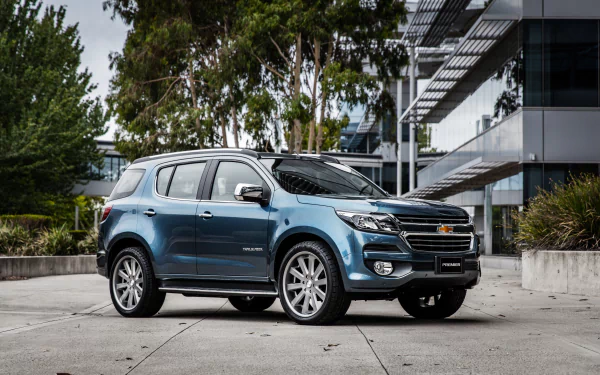 A sleek Chevrolet TrailBlazer SUV parked outdoors near modern architecture, captured in sharp 4K Ultra HD quality.