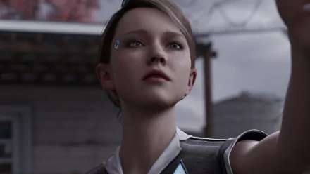 Close-up of Kara from the Detroit: Become Human video game, 4K Ultra HD PC desktop wallpaper showing her determined expression and android LED against a muted, overcast backdrop.