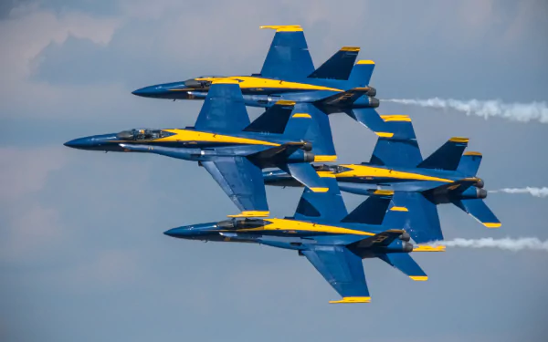 Blue Angels F/A-18 jet fighters in tight diamond formation with smoke trails over clouds — military air show photo, HD PC desktop wallpaper/background.