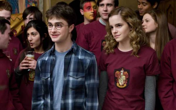 HD PC desktop wallpaper featuring Hermione Granger and Harry Potter from the movie Harry Potter and the Half-Blood Prince, surrounded by Hogwarts students at a social event.