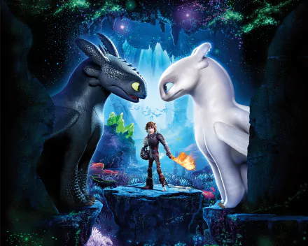 HD desktop wallpaper featuring Toothless, White Night Fury, and Hiccup from How to Train Your Dragon: The Hidden World. The trio stands in a mystical, glowing cave, showcasing the movie's fantasy realm.