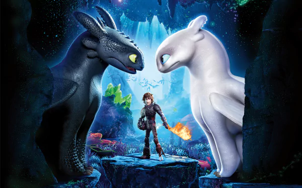 HD desktop wallpaper featuring Toothless, White Night Fury, and Hiccup from How to Train Your Dragon: The Hidden World. The trio stands in a mystical, glowing cave, showcasing the movie's fantasy realm.