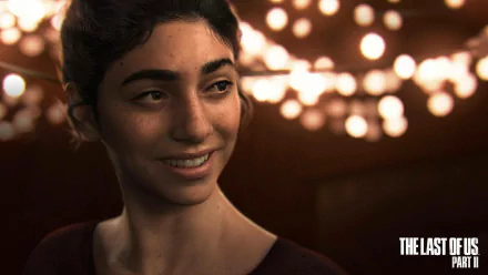 HD PC desktop wallpaper featuring Dina from the video game The Last of Us Part II, showcasing detailed character art with warm lighting and a soft smile.