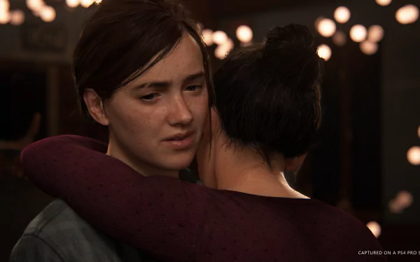 Dina and Ellie from The Last of Us Part II share an intimate moment in this 4K Ultra HD PC wallpaper from the video game.