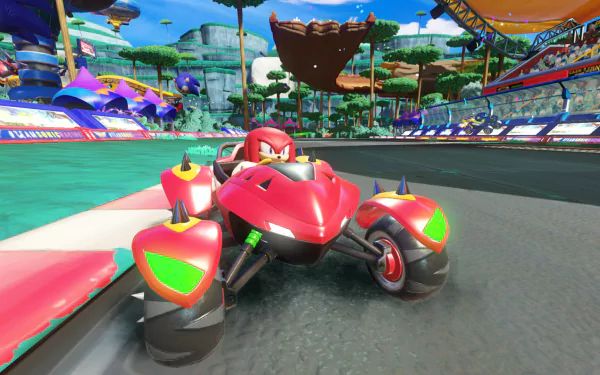 HD wallpaper featuring a scene from Team Sonic Racing with a vibrant race track and Knuckles in his red race car.