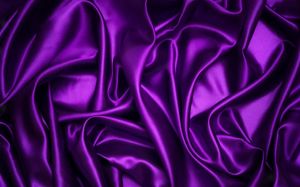 Abstract purple silk texture with smooth folds and rich tones, designed as a 4K Ultra HD PC desktop wallpaper and background.
