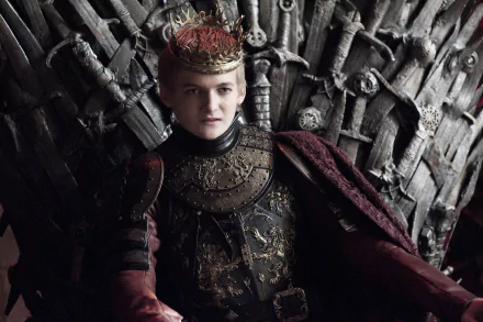 Joffrey Baratheon in ornate crown and armor seated on the Iron Throne — Game of Thrones HD PC desktop wallpaper.