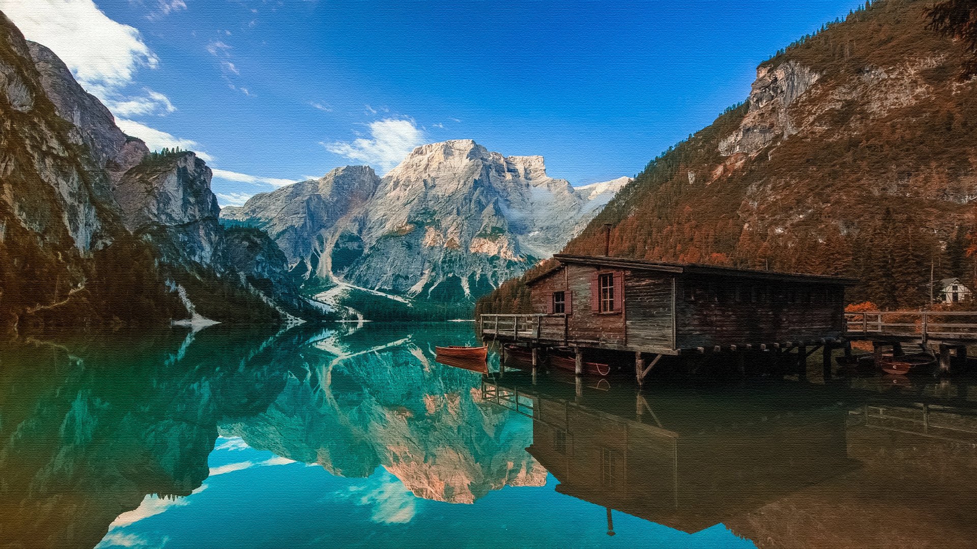 4K Ultra HD image of a serene mountain lake with crystal-clear reflections, featuring a rustic man-made boathouse along the water’s edge under a bright blue sky.