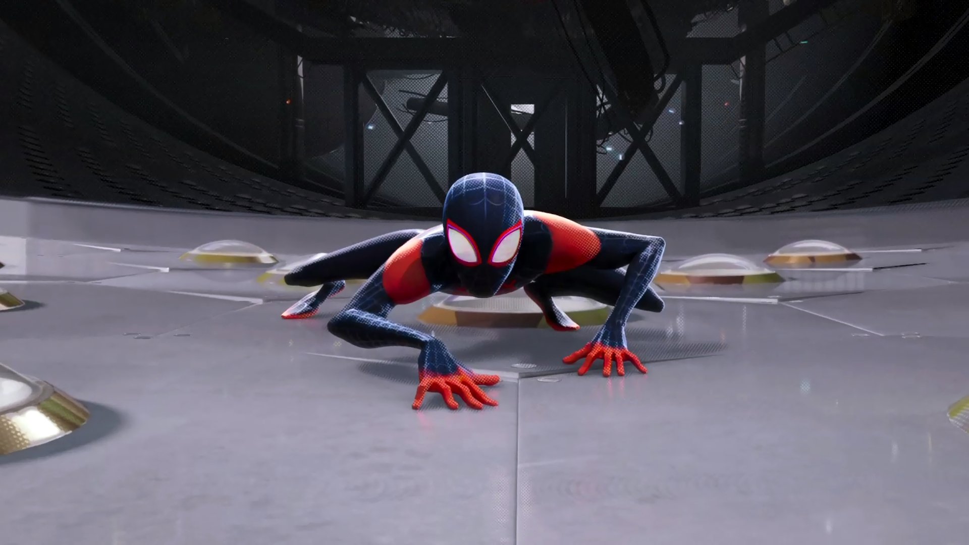 4K Ultra HD PC desktop wallpaper featuring Spider-Man from the movie Spider-Man: Into The Spider-Verse in a dynamic crouching pose inside a dimly lit industrial setting.