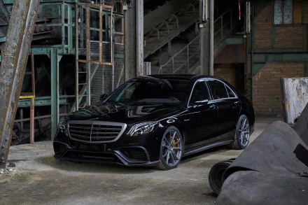 Black Mercedes-Benz S-Class parked inside an industrial setting, displayed as an HD PC desktop wallpaper and background.