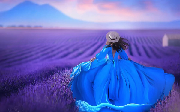 A woman in a flowing blue dress and straw hat stands in a vast lavender field under a pastel sky, creating an artistic and serene HD desktop wallpaper.