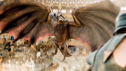 Drogon from Game of Thrones soars over a stunned crowd in a cinematic scene, wings outstretched — HD PC desktop wallpaper and background.