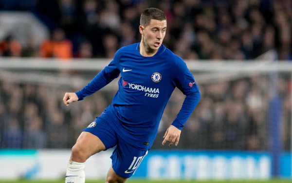 HD wallpaper featuring a soccer player in a blue Chelsea kit on the field, creating a dynamic desktop background.