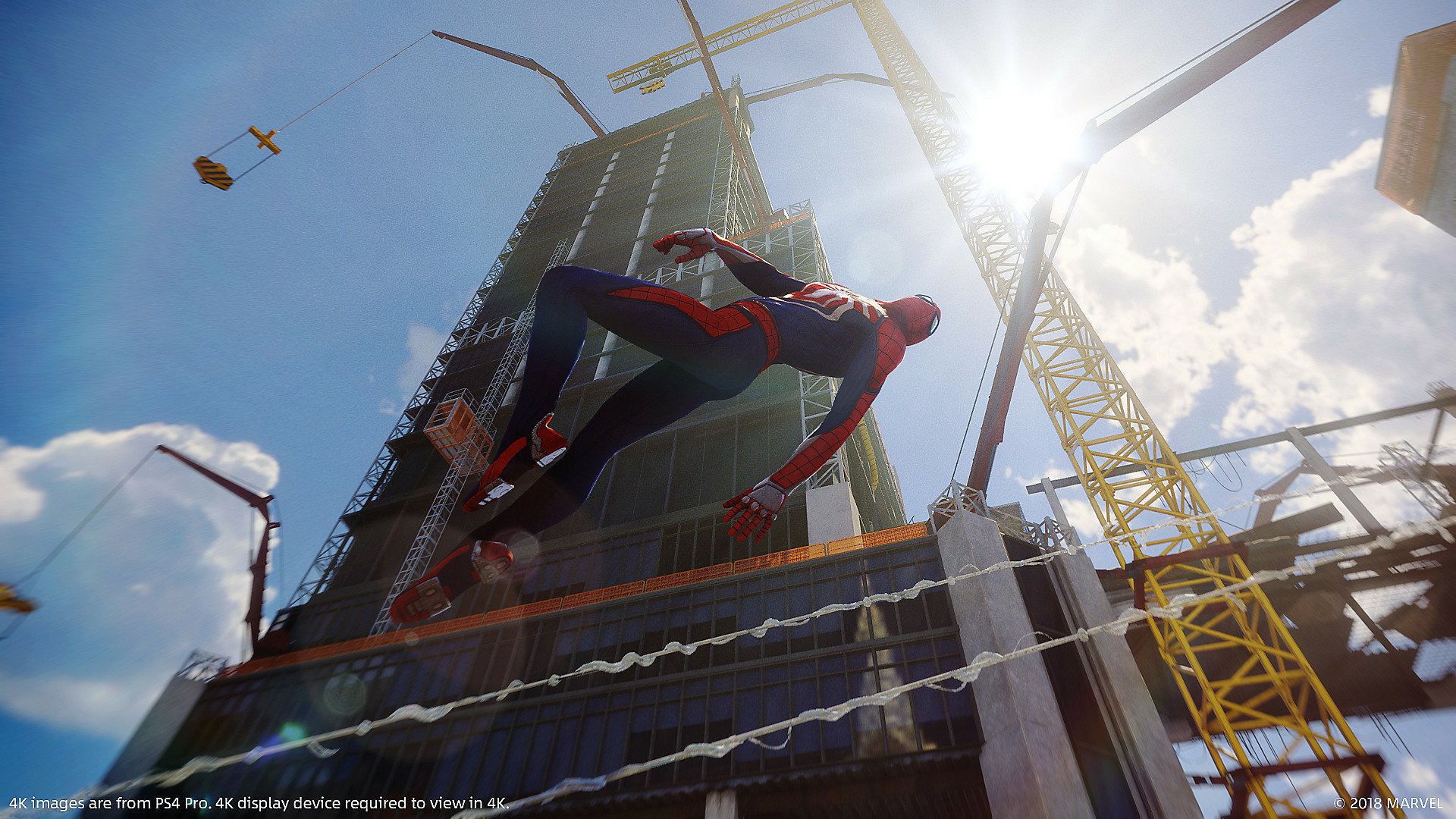 HD PC desktop wallpaper featuring Spider-Man from the Spider-Man (PS4) video game, swinging through a sunny cityscape with helicopters and cranes in the background.