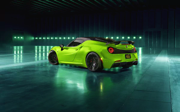 Vibrant green Alfa Romeo 4C supercar on a reflective floor in a dim industrial garage — 4K Ultra HD desktop wallpaper showcasing the sleek performance vehicle