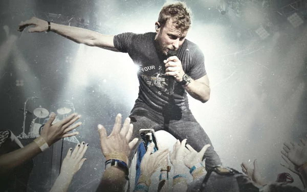 HD desktop wallpaper featuring a dynamic concert scene with a performer engaging with the audience, suitable as a background.