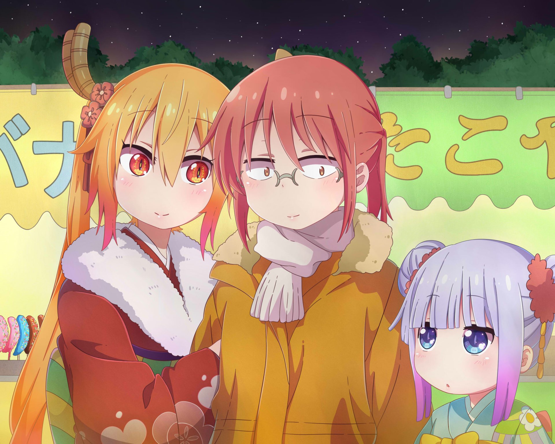 HD PC wallpaper of Miss Kobayashi's Dragon Maid: Tohru, Kobayashi and Kanna bundled in winter coats at a colorful festival stall, sharing warm expressions under the evening sky.