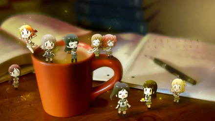 Chibi versions of Riko Sakurauchi, Chika Takami, You Watanabe, and others from Love Live! Sunshine!! around an orange mug on a desk with papers and a pen, HD wallpaper.