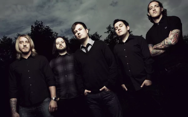 HD desktop wallpaper featuring the band Funeral for a Friend, showcasing the members in dark attire against a moody, cloudy backdrop.
