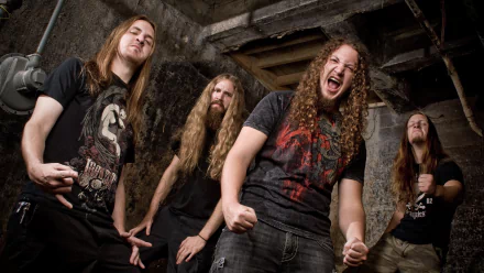 HD wallpaper of the band Lazarus A.D., featuring the members posing with enthusiasm in a gritty, industrial setting.