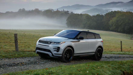 Silver Range Rover Evoque SUV vehicle parked on a gravel lane with misty hills in the background — 4K Ultra HD PC desktop wallpaper and background.