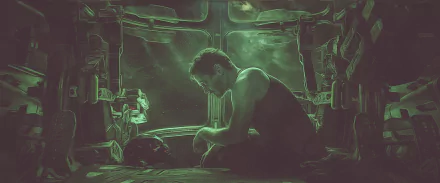 HD desktop wallpaper featuring Robert Downey Jr. as Tony Stark in a poignant scene from Avengers: Endgame, set in a dimly lit spaceship.