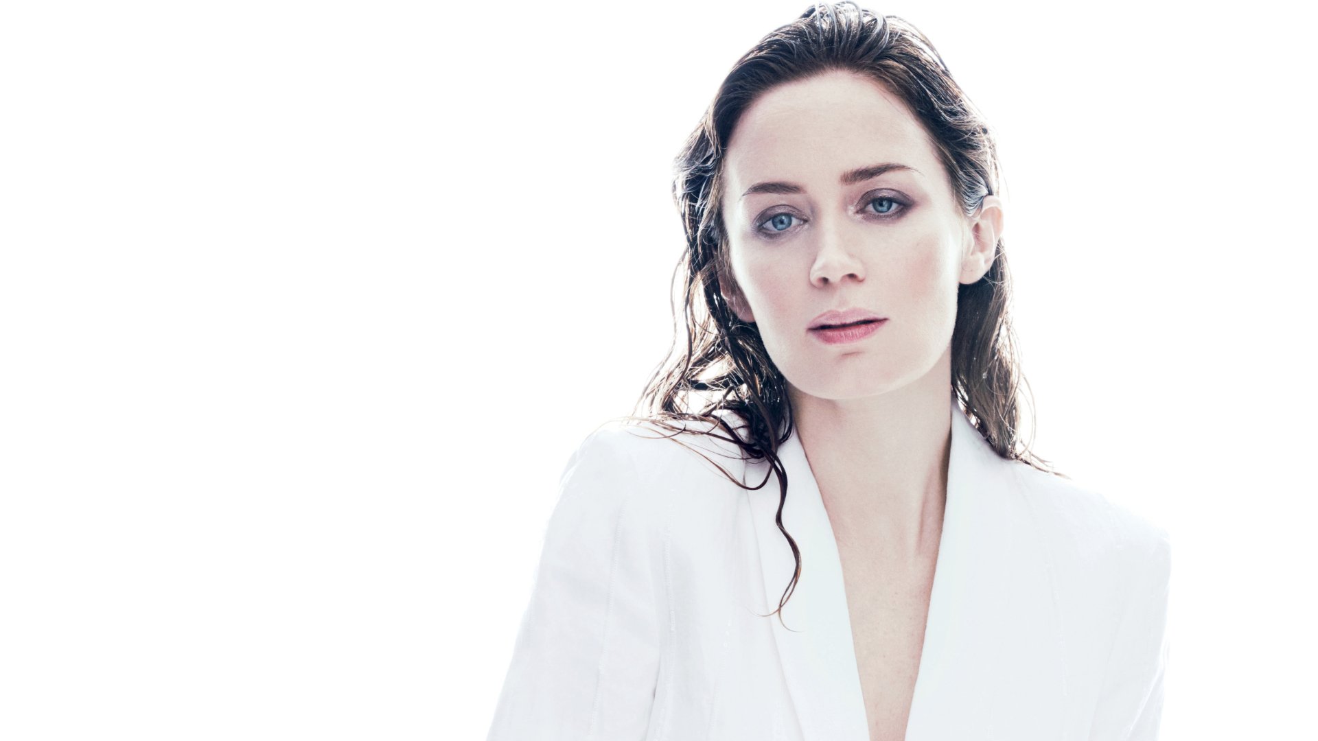 Portrait of English actress Emily Blunt with blue eyes and brunette hair, featured in a high-resolution 4K Ultra HD PC desktop wallpaper.