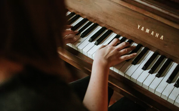  Playing the piano by Jordan Whitfield