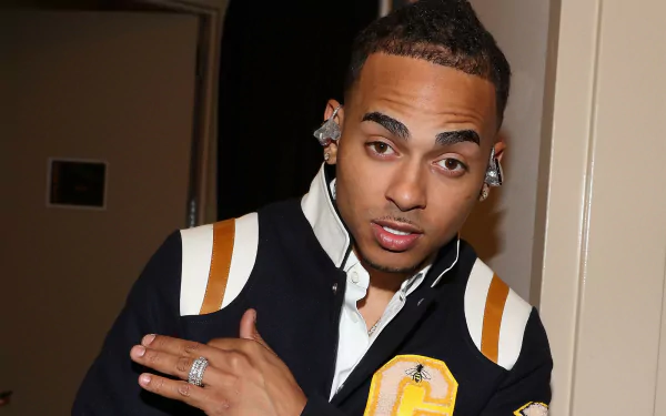 HD desktop wallpaper featuring a man in a varsity jacket posing for the camera, tagged as Ozuna.